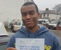 Nicholas with Driving test pass certificate